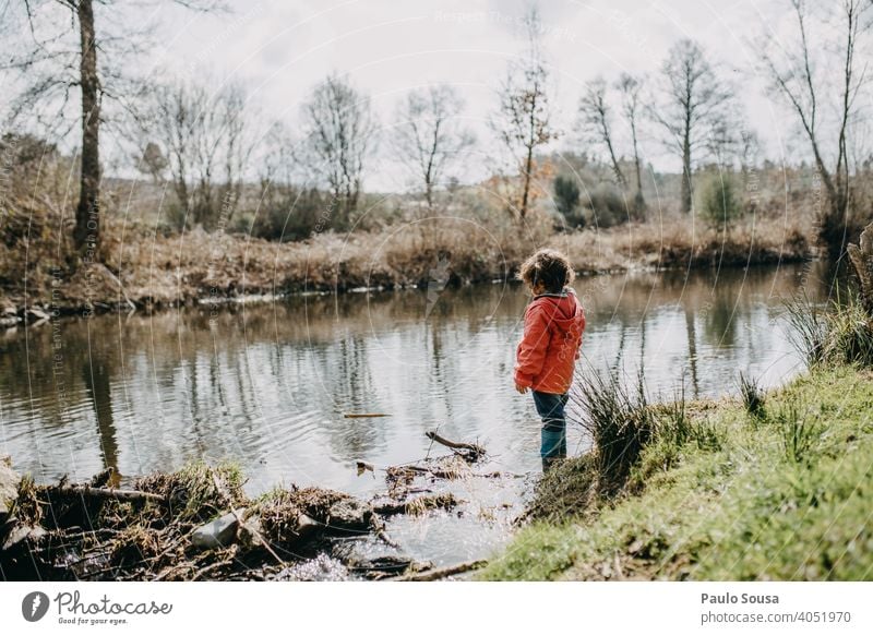 Cute girl  at riverside Child childhood 1 - 3 years Girl Colour photo Caucasian River Nature Authentic Happy Joy Exterior shot Playing Happiness Human being