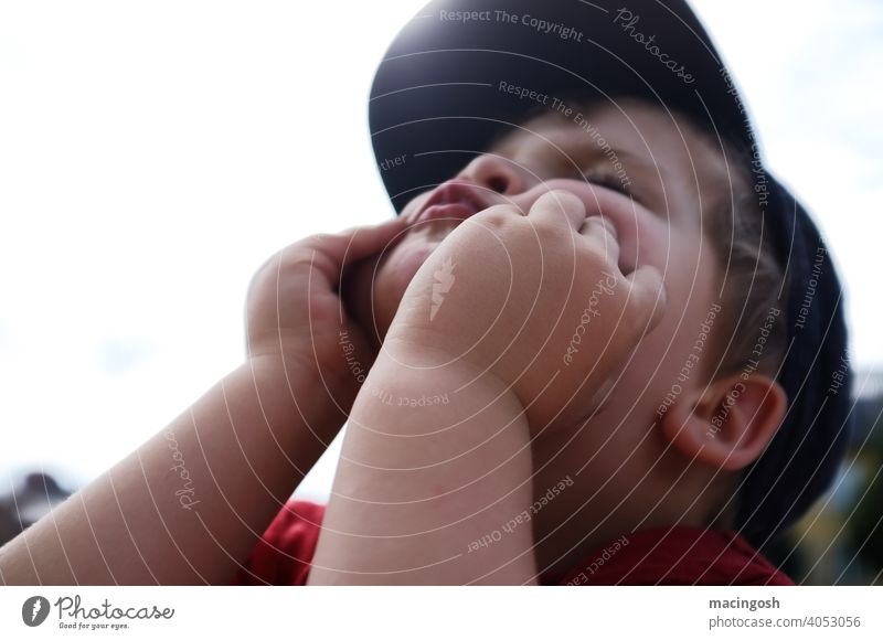 Little preschool boy makes faces Back-light Diffused light Boy (child) Child preschool age preschool child Grimace Infancy Joy Cute Playing blow puff up cheeks