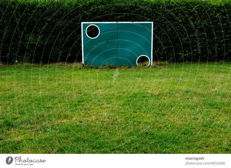 Old goal wall on an empty sports field Foot ball Football pitch Sporting grounds lockdown Sports Sports Training Soccer Training Soccer training Green Deserted