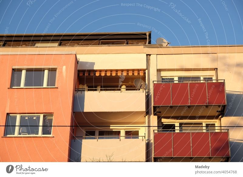 Modern apartment house in pastel colours with balconies in the light of the evening sun in summer in the Hanauer Landstraße in the Ostend of Frankfurt am Main in Hesse