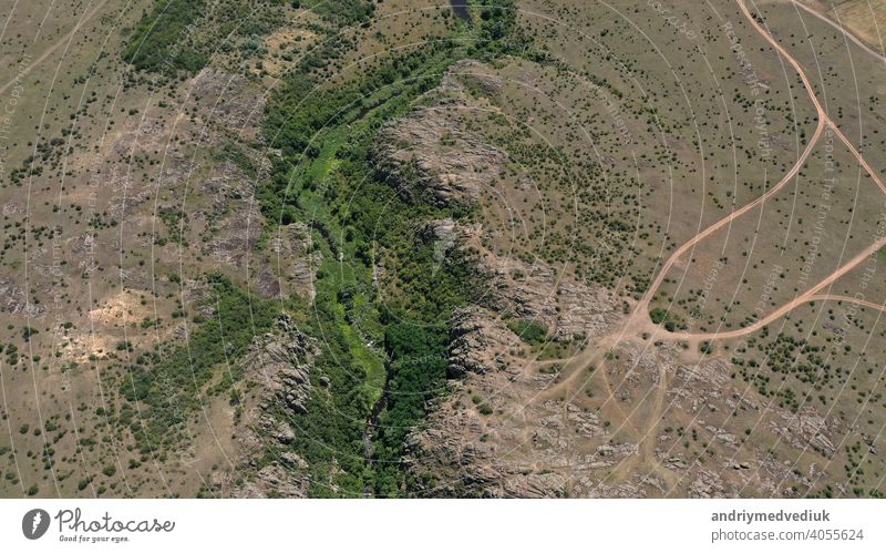 Aerial View of the Textures and Patterns of the rocks and mountain river with rifts and green view aerial above tourism pattern nature valley landscape texture