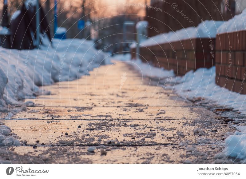 Sidewalk in winter at sunset Paving tiles Twilight Footpath off Snow Sunset Winter Winter maintenance program Frozen evacuated shoveled smooth Cold Walking