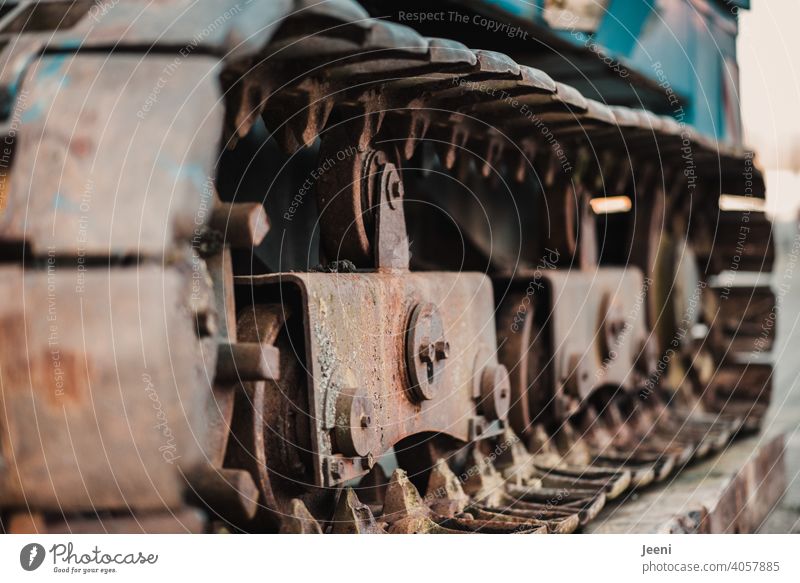 Details of the chain of a tracked excavator in close-up view Chain Hydraulic excavator Chain links Old corroded Construction machinery Machinery Annihilate Rust