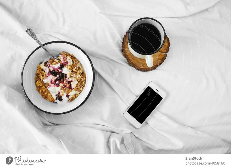 Breakfast in bed top view breakfast coffee cup white tray hot food background drink sugar sweet warm tea cream mood home closeup cozy muesli oats yoghurt phone