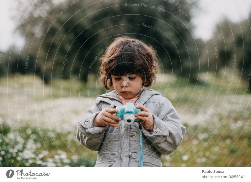 Child taking pictures with camera 1 - 3 years Caucasian Girl Photography Photographic technology Photographer Camera Colour photo Human being Infancy