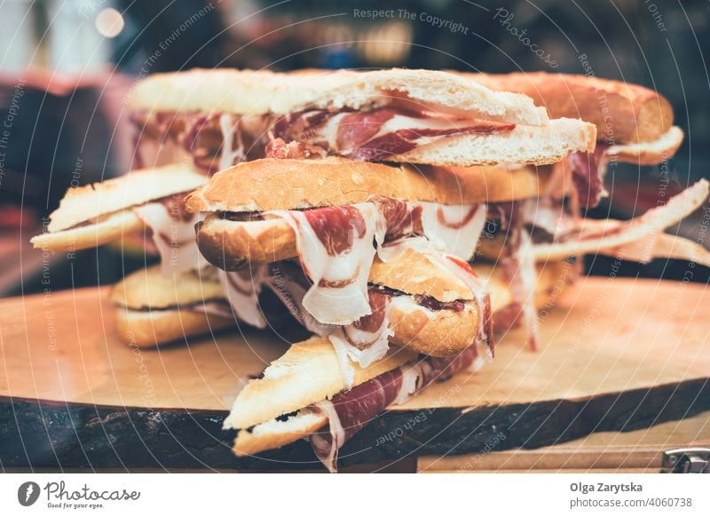 Iberian ham sandwiches. jamon meat gourmet spanish cooking serrano bread hamon ingredient food fastfood appetaizer proscuitto bacon baguette pork slice snack