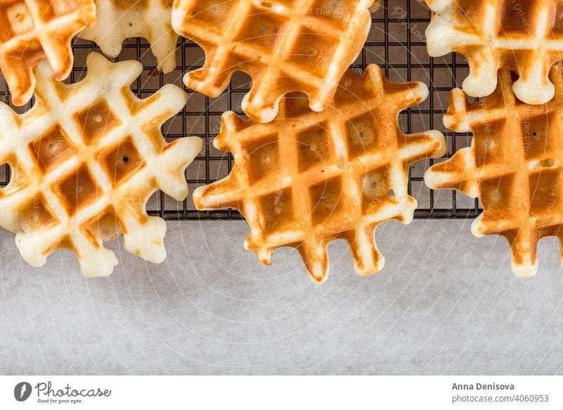 Traditional homemade belgian waffles on light background breakfast dessert blueberry raspberry syrup baked sweet fresh pastry belgium delicious snack bakery