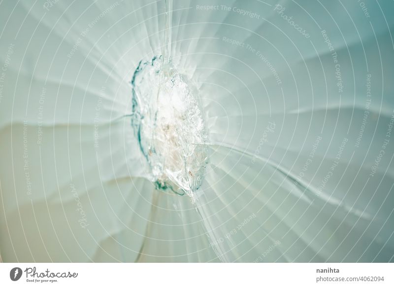 Image of a broken glass after vandalism crystal damage strike old damaged crack shot fissure decay abandoned texture textured image resource wallpaper backdrop