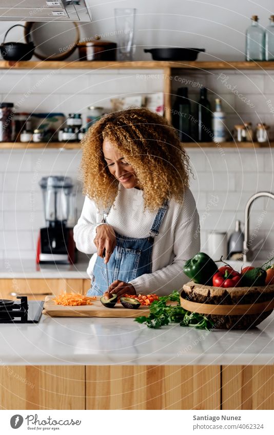 Woman preparing food in kitchen. middle age couple love cooking home cozy caucasian relationship female happy person stove woman alone beautiful girl smiling