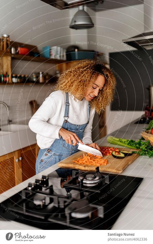 Woman preparing food in kitchen. middle age couple love cooking home cozy caucasian relationship female happy person stove woman alone beautiful girl smiling