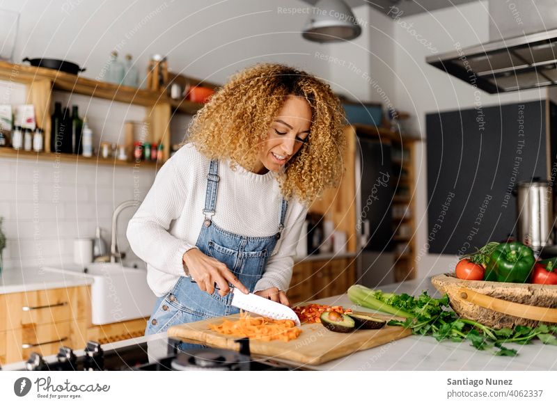 Woman preparing food in kitchen. middle age couple love cooking home cozy caucasian relationship female happy person stove woman alone beautiful girl smiling