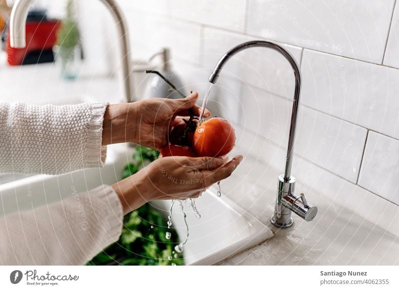 Woman cleaning vegetables in kitchen. middle age couple love cooking home cozy caucasian relationship preparing female happy person woman alone girl interior