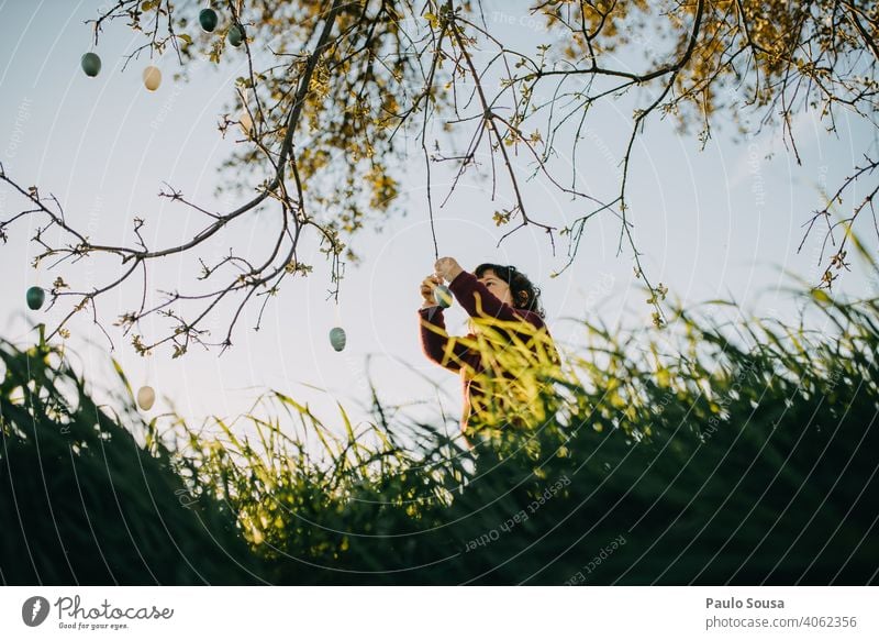 Child playing with Easter eggs outdoors childhood 1 - 3 years Caucasian Lifestyle Authentic Nature Natural Playing Happiness Exterior shot Toddler Joy