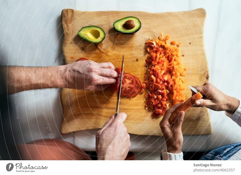 Couple preparing food in kitchen. middle age couple love cooking home cozy caucasian relationship female happy person stove woman beautiful girl smiling two