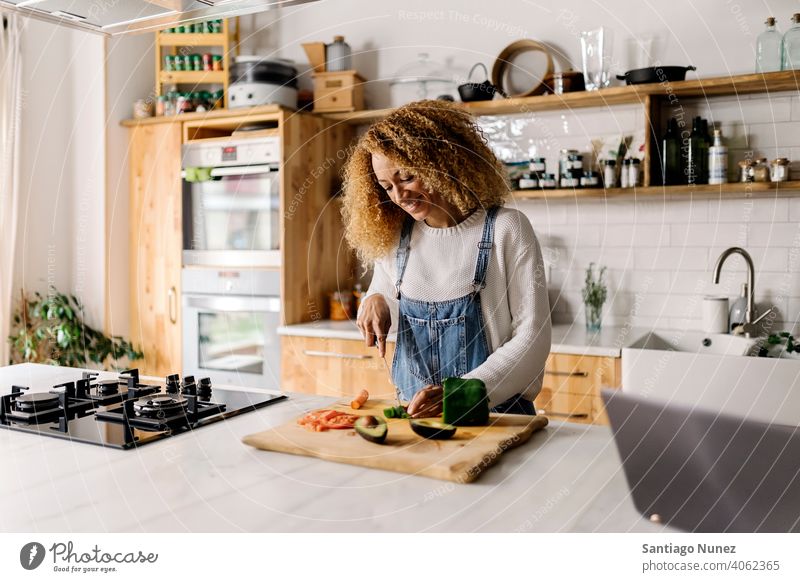 Woman preparing food in kitchen. middle age couple love cooking home cozy caucasian relationship female happy person stove woman alone beautiful girl smiling