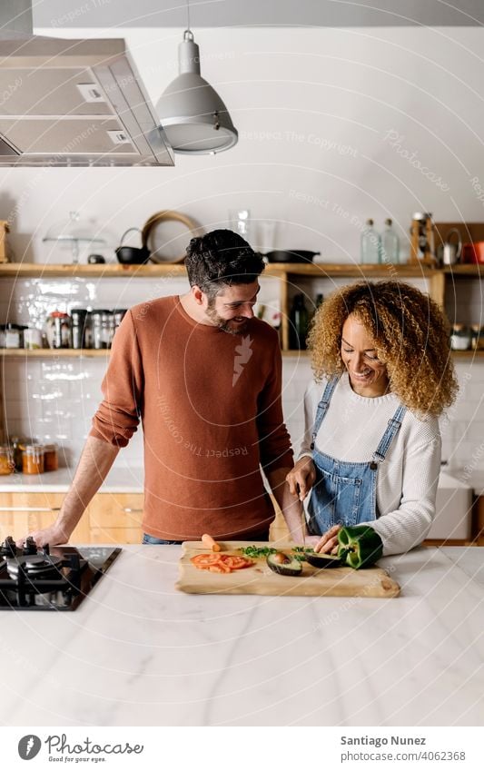 Couple preparing food in kitchen. middle age couple love cooking home cozy caucasian relationship female happy person stove woman beautiful girl smiling two