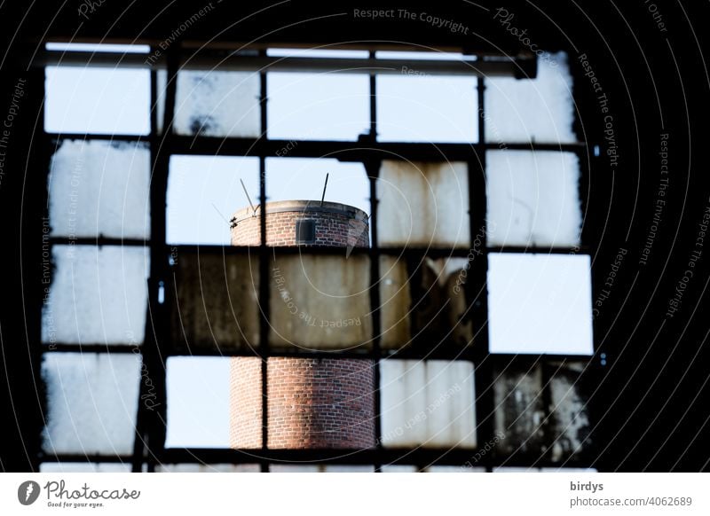 Steelworks, colliery, industrial monument Völklinger Hütte, glass panes in the steelworks polluted by dust and heat. Industrial chimney... Steel production