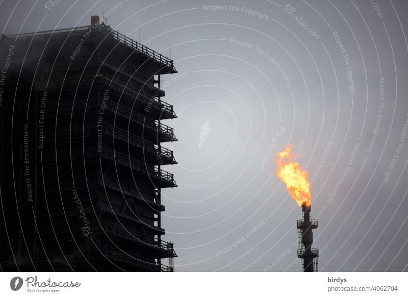 Extinguishing tower from the Thyssen-Krupp coking plant in Duisburg. Serves to extinguish hot coke. Next to it a gas flare with a gas flame with which excess gas is flared off.