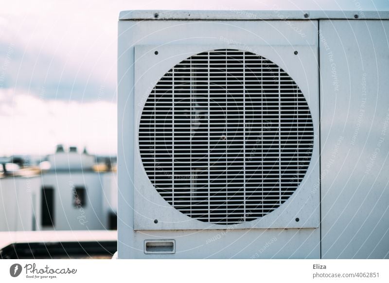 Air source heat pump on the roof of a residential house. Modern and environmentally friendly heating technology. Heating Roof Sustainability Apartment Building