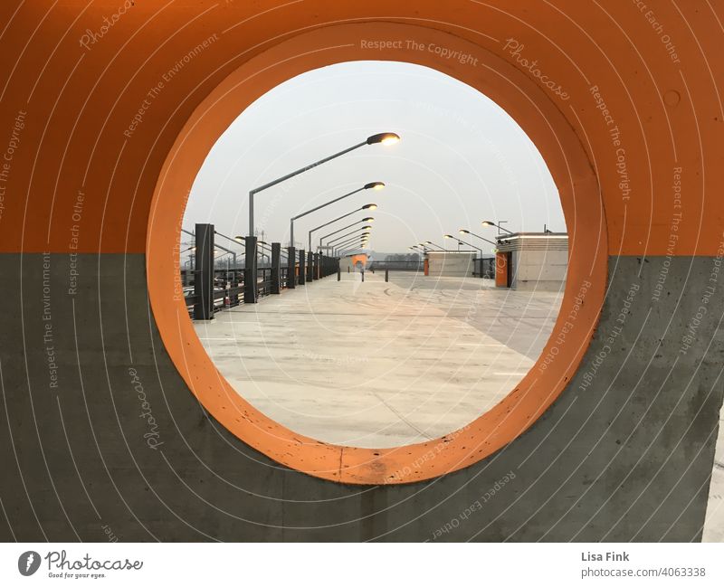 View on a parking garage, through a window Parking garage Orange Gray View from a window Concrete Day Exterior shot