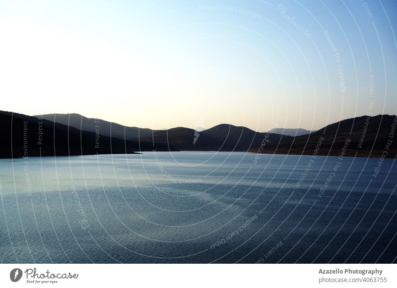 Lakeside view in the evening. background beautiful blue bright calm clouds coast color colorful dawn day dock dusk grass green holiday horizon jetty lake