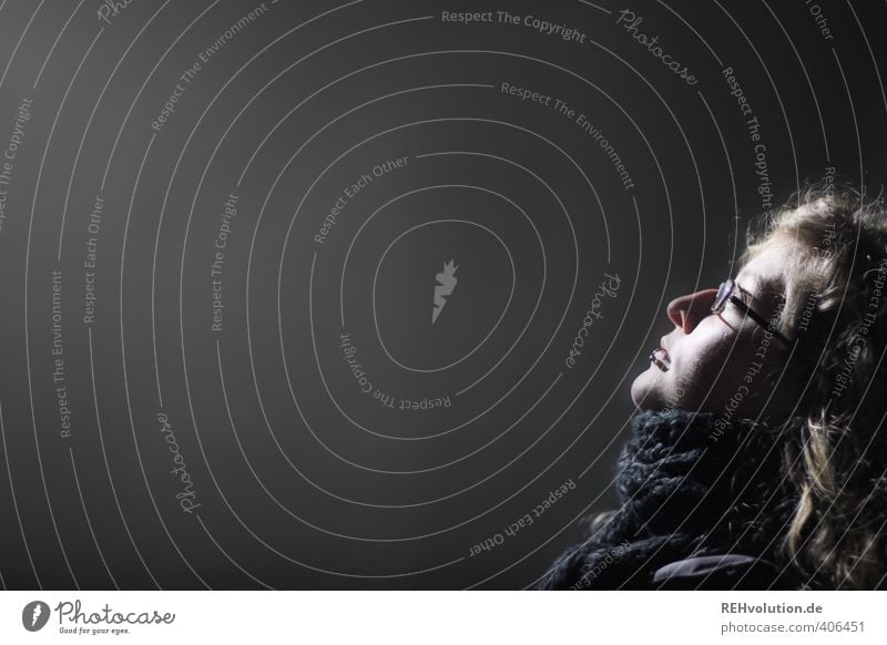 Young woman looks into the light Human being Feminine Youth (Young adults) Woman Adults Head 1 18 - 30 years Illuminate Stand Dark Black Self-confident Trust