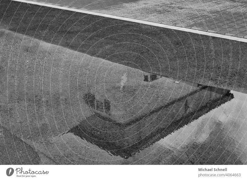 Road, puddle and reflection Rain puddle Reflection Reflection & Reflection Water House (Residential Structure) Street Black & white photo black-and-white