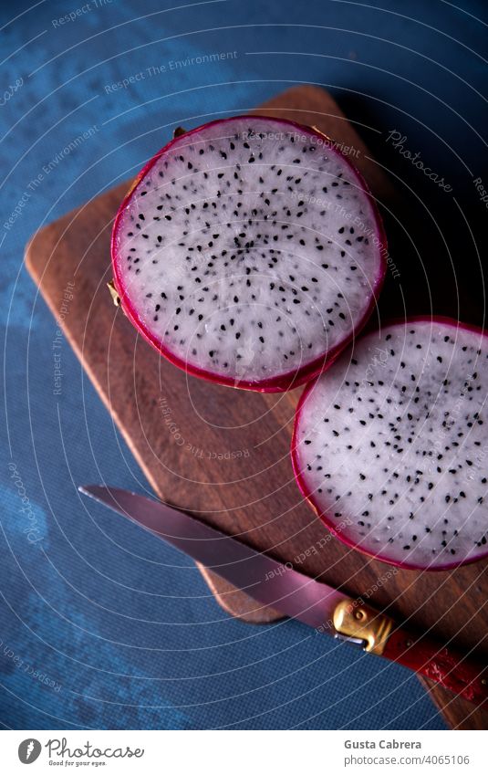 Dragon fruits cut out and exposed on dark backgrounds. thai nature ripe alimentary fresh red health healthy closeup macro pink dragon vibrant food juicy asia