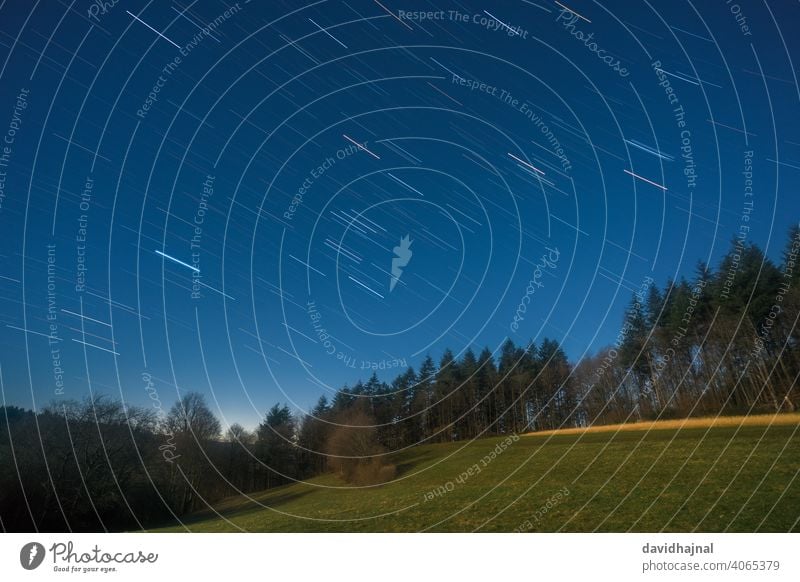 Star trails over the Odenwald near Lampenhain. Dusk Moonlight grove of lamps Germany Europe Mountain Night Starry Path star trails Stars Follow-up Hiking trails