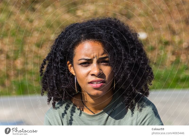 Beautiful dark haired woman Woman African American African woman Meditative portrait Face look Looking Charming Attractive Black colored emotion pretty