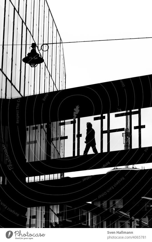 Man walking through a bridge made of glass Glass Bridge Light black-and-white Silhouette Bremen radio bremen Shadow Sun Back-light Summer Sky Clouds Action