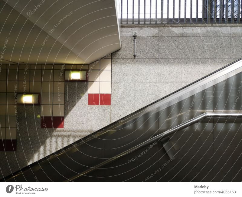 Escalator at the entrance to subway and suburban train in sunshine at Zoo station in the capital Berlin in Germany Entrance Way out Train station