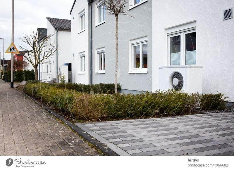 Air source heat pump in front of a terraced house. Modern, environmentally friendly heating technology, air source heat pump Heating Air-to-water heat pump