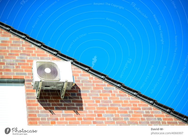 Air-source heat pump on a roof - ecological and future-oriented - modern and environmentally friendly heating technology Air source heat pump Heat generation