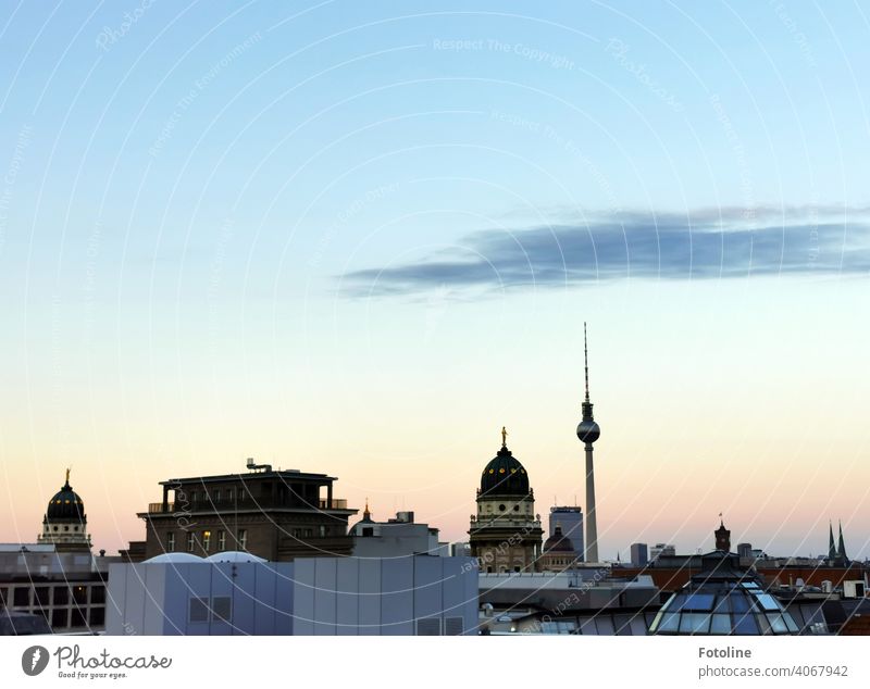 Berlin in the beginning sunset from above with view in the direction of the television tower. Television tower Berlin TV Tower Alexanderplatz Landmark Sky