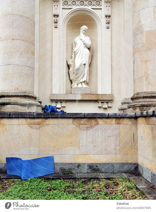 Pondering, the statue looks down at the windswept bed of a homeless man Statue Figure Culture Architecture Old Historic Sculpture Tourist Attraction City trip