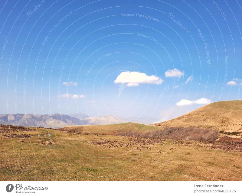 Image of a mountain landscape with a blue sky and clouds Landscape Landscaping Field field flora field flowers herbage countryside countryside landscape