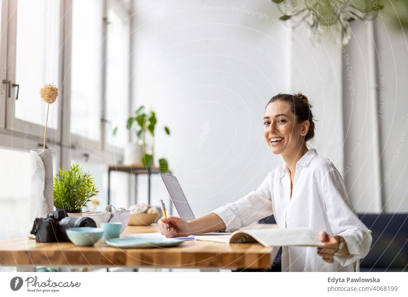 Young female freelancer working in loft office millennials student hipster indoors window natural girl adult one attractive successful people confident person