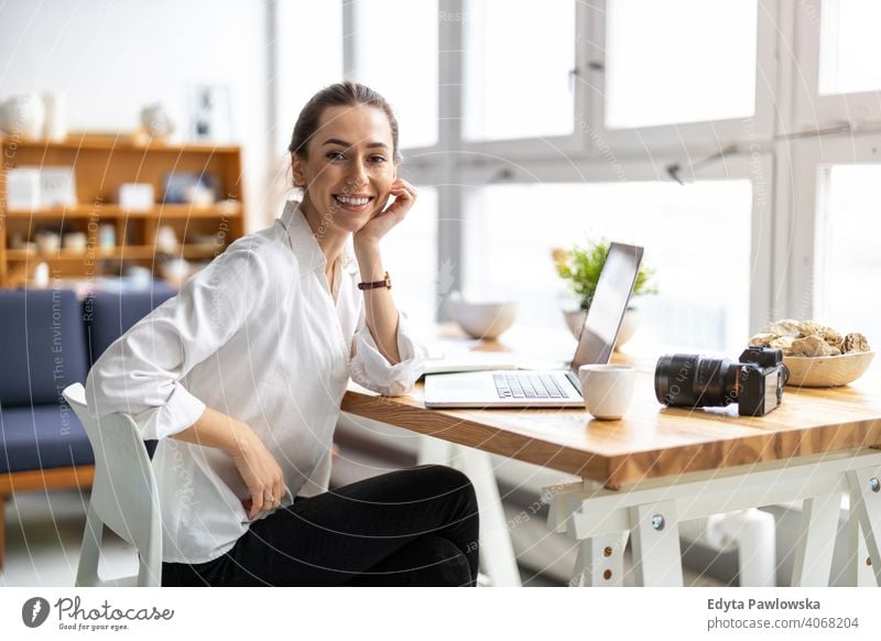 Young female freelancer working in loft office millennials student hipster indoors window natural girl adult one attractive successful people confident person