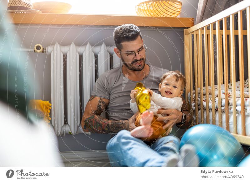 Father playing with his little son at home single parent single dad fathers day fatherhood stay at home dad paternity leave modern manhood family child house