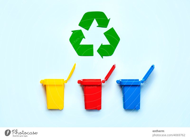 Yellow, red and blue recycle bins with recycle symbol. Recycling concept recycling bottle environment save arrangement green materials environmental