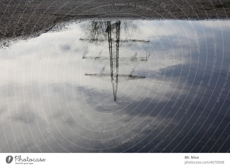 Power pole reflected in a puddle of rain Reflection Electricity Overhead line Puddle Rain Electricity pylon Transmission lines Water High voltage power line