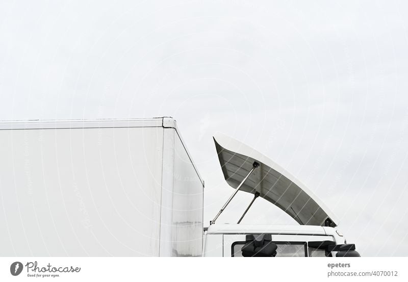 Roof of a white truck against an overcast sky automobile Large blurriness Cargo Commerce Copy Space Delivery E-commerce e-commerce cargo Heavy Highway Industry