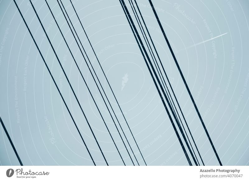 Electricity wires view against the sky abstract architecture background blue cable danger design detail distribution electric electrical electricity energy grid