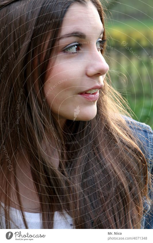 View to the side portrait Long-haired naturally Hair and hairstyles Brunette Feminine Face 18 - 30 years pretty Facial expression Face of a woman Emotions