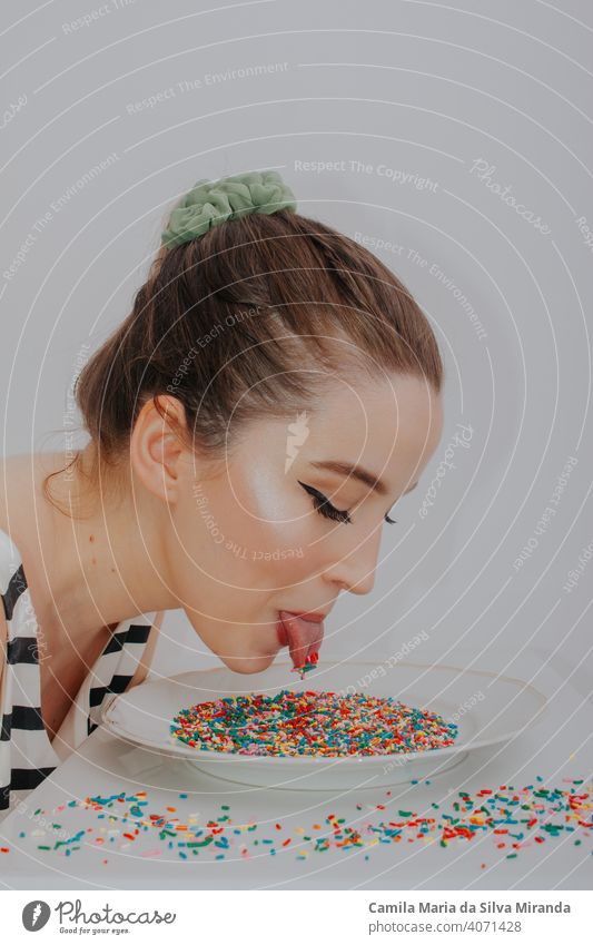 Woman with candy colorful confetti anniversary anxiety background beautiful birthday celebration copyspace creative decoration easter fashion fashionable