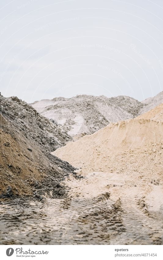 Pile of sand on a construction site on a cloudy day background Construction Copy Space Detail Geology Gravel Grit Heap Industrial industrial background Industry