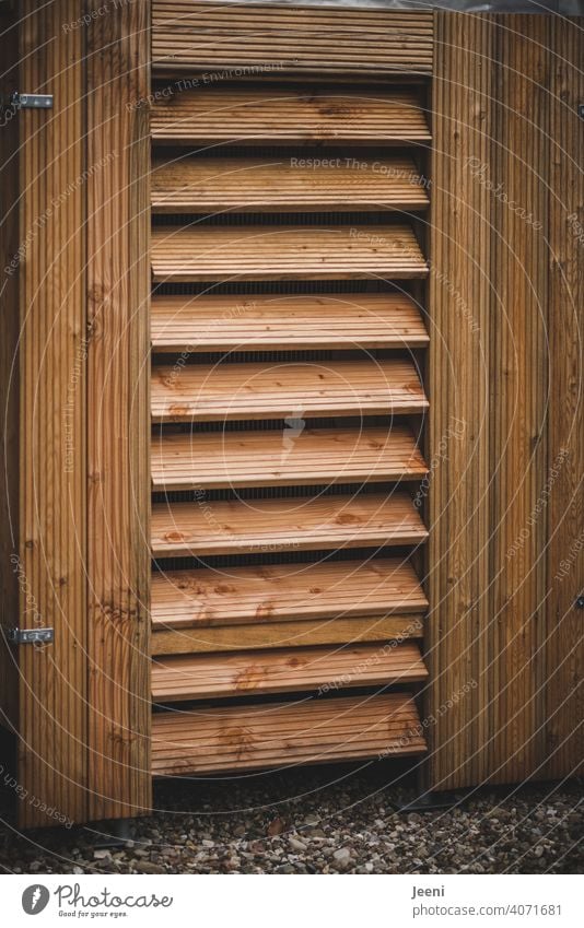 Air-source heat pump on a single-family house - clad in wood | ecological, sustainable, modern and environmentally friendly heating system Air source heat pump