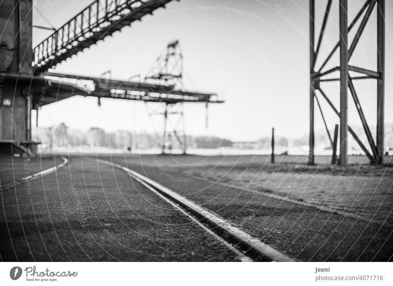 Rails and cranes at an abandoned port facility Harbour Port area Dockside crane Crane Industry Rail transport rails Old forsake sb./sth. lost places Past Change