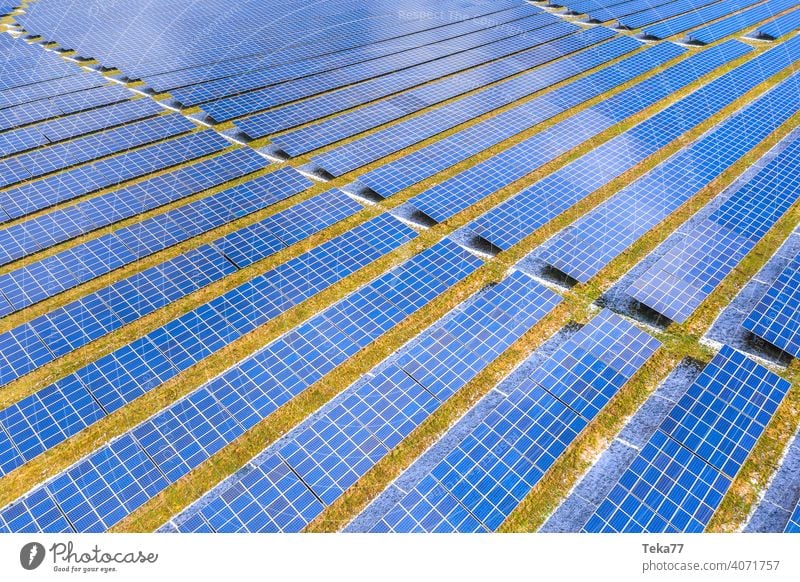 a modern solar park from above solar cells sun sunny winter energy green energy sun energy clouds modern solar cells blue blue solar cells